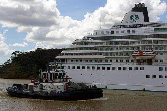 The Crystal Symphony Cruise Ship Back Side View with Tugboat